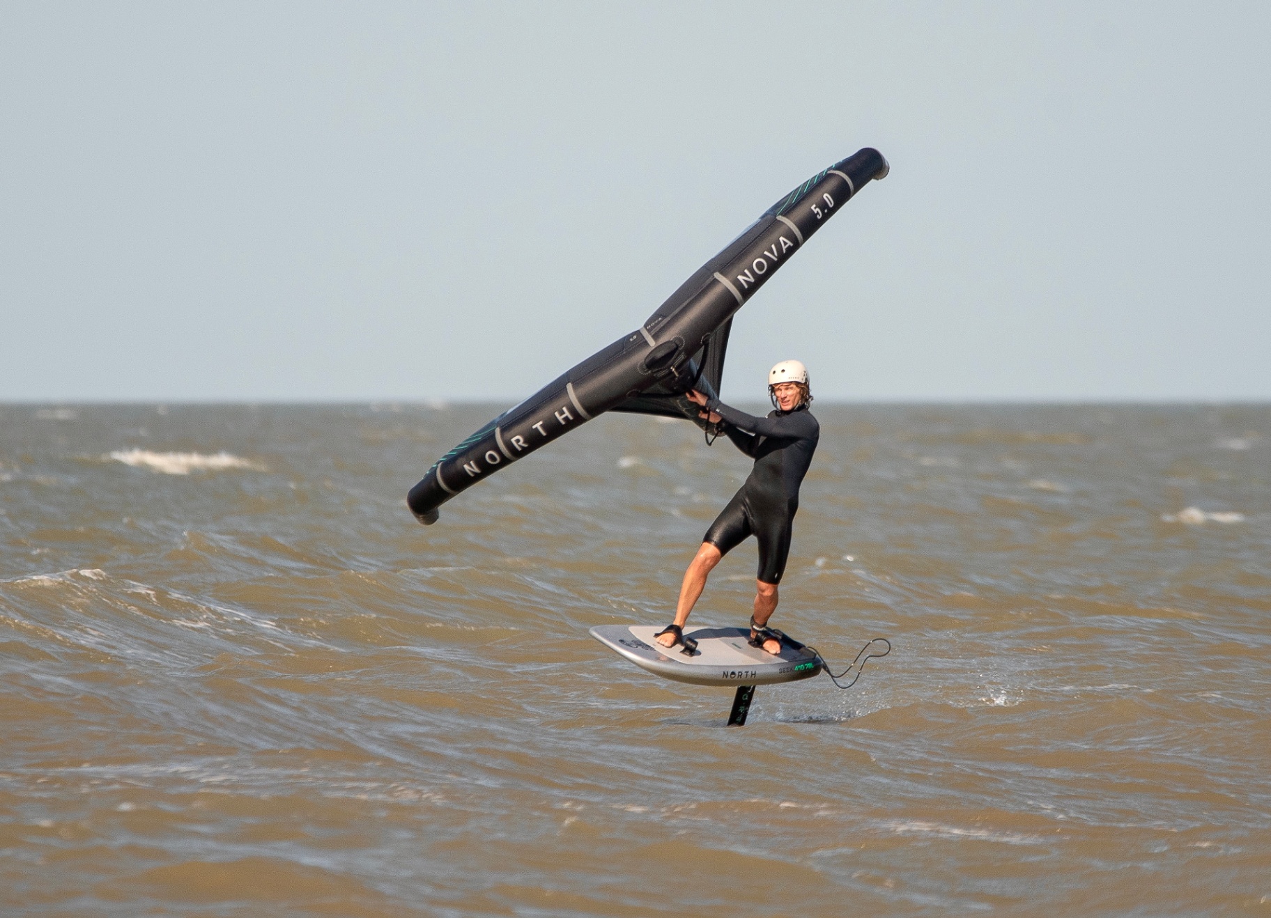 Wingfoiler cruising along the Tendring coastline