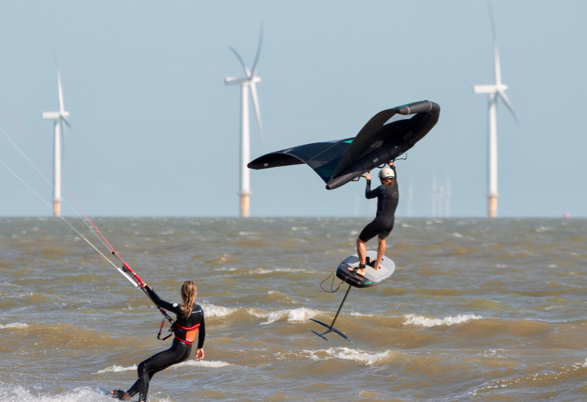 Wingfoiler boosting airborne with Gunfleet turbines behind