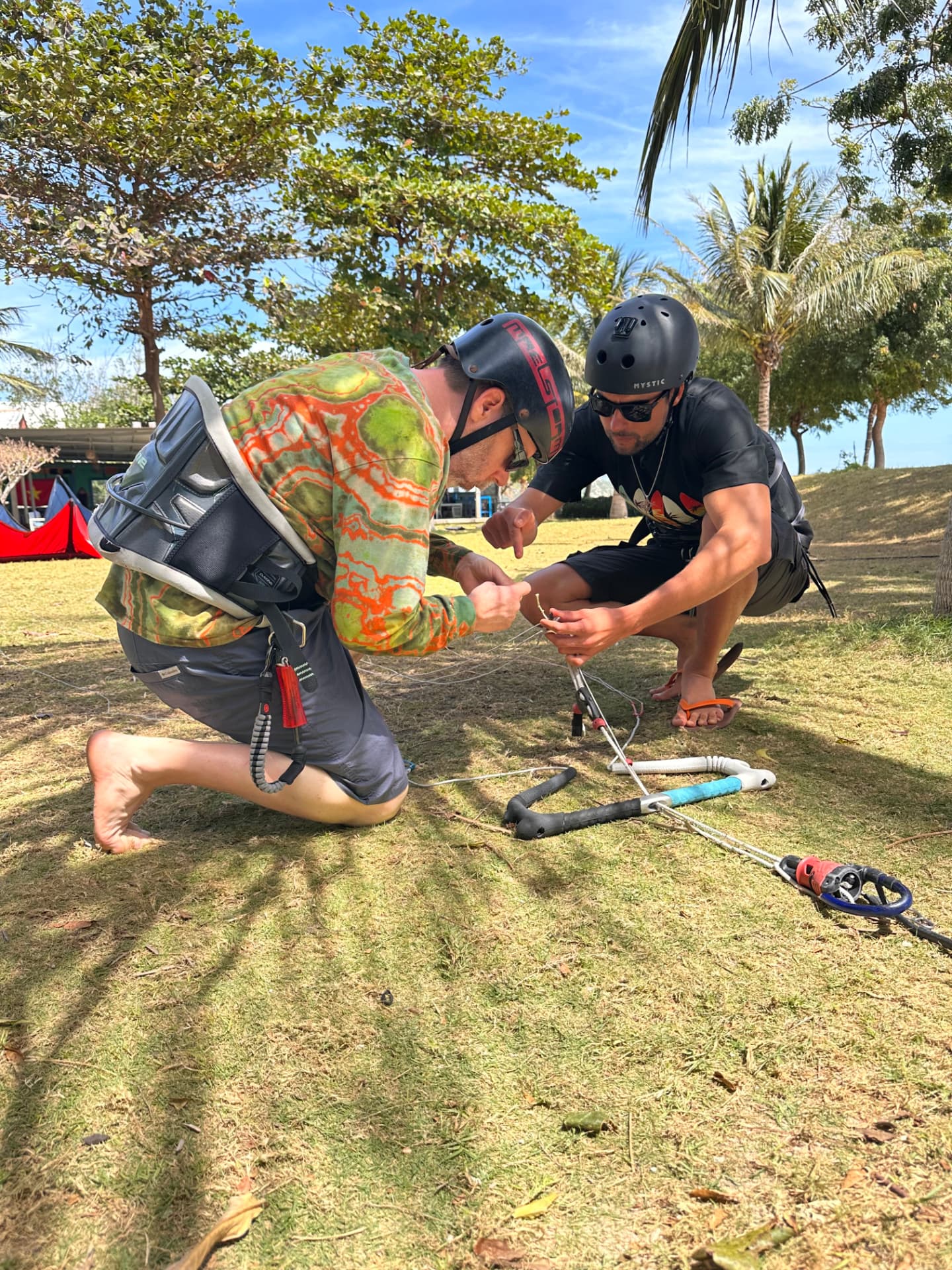 Instructor rigging a control bar before an assessment
