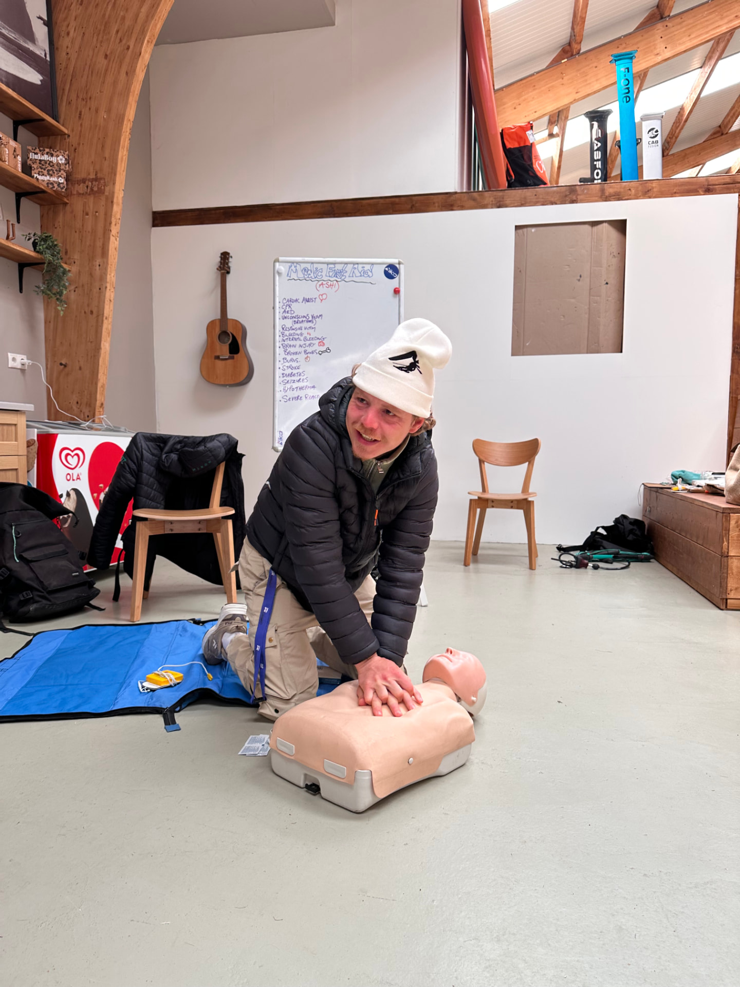 Candidate practising CPR on a manikin during first aid training in Essex